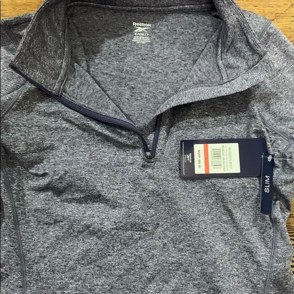 Reebok Tops - Reebok Heather gray half zip top with thumb holes, size S.